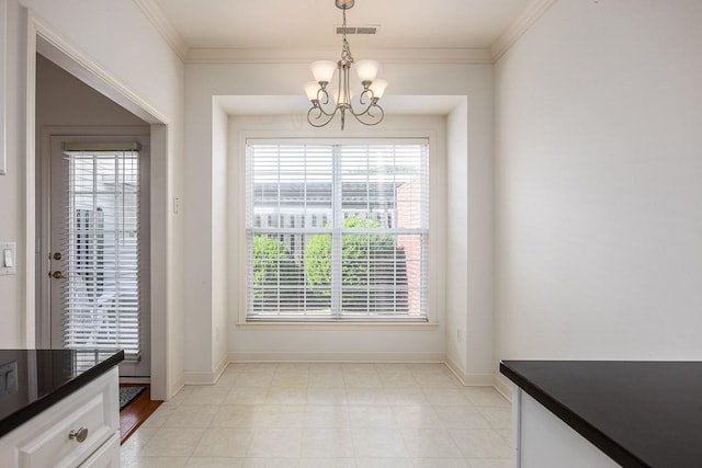 dining space with a wealth of natural light, ornamental molding, and a chandelier