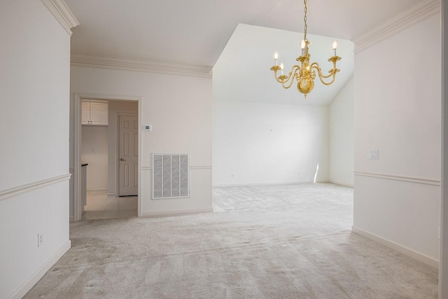 carpeted spare room with crown molding and a chandelier