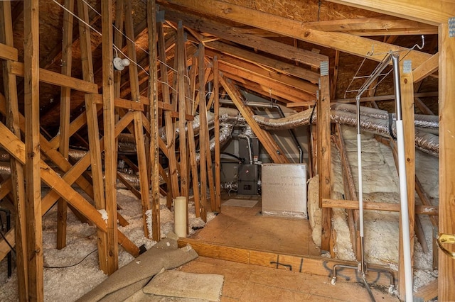 attic featuring heating unit