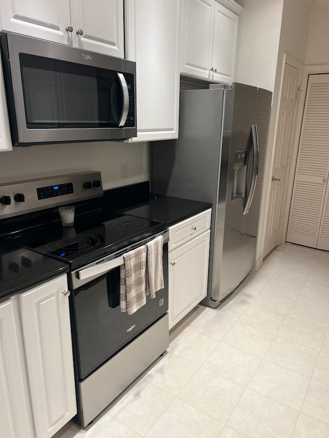 kitchen featuring white cabinets and appliances with stainless steel finishes