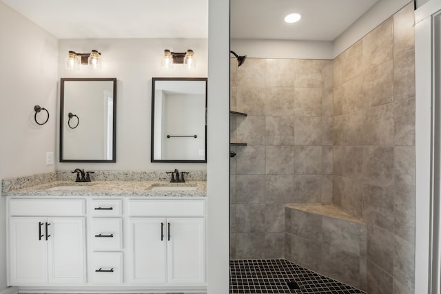 bathroom featuring vanity and a tile shower