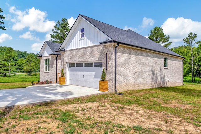 view of property exterior featuring a garage and a yard