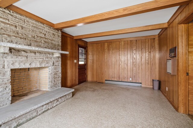 unfurnished living room featuring wooden walls, a stone fireplace, carpet flooring, beam ceiling, and a baseboard radiator