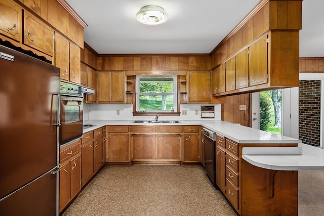 kitchen with oven, a peninsula, light countertops, freestanding refrigerator, and dishwasher