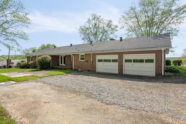 single story home with a garage