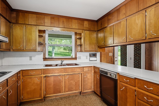 kitchen featuring a peninsula, a sink, light countertops, dishwasher, and brown cabinetry