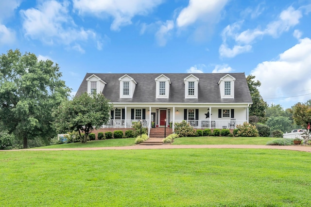 cape cod home with a front lawn and a porch