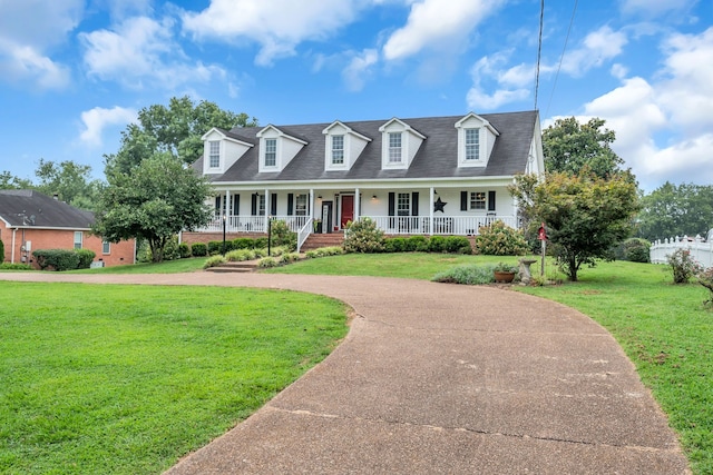 cape cod home featuring a front lawn and covered porch