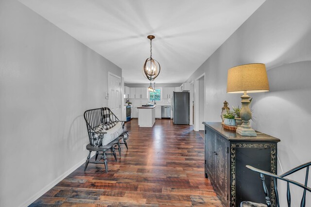 interior space with dark hardwood / wood-style floors and a chandelier