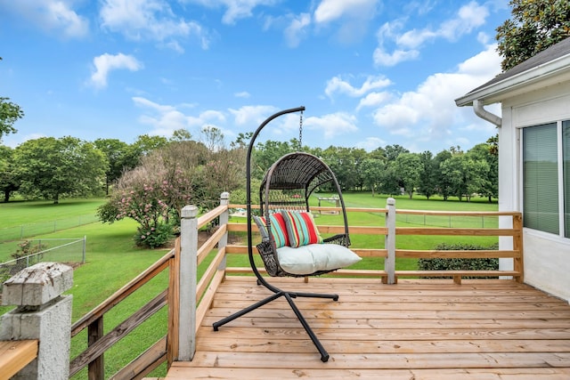 wooden deck with a lawn