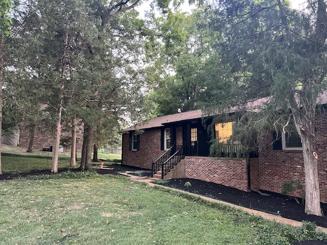 ranch-style house with a front yard