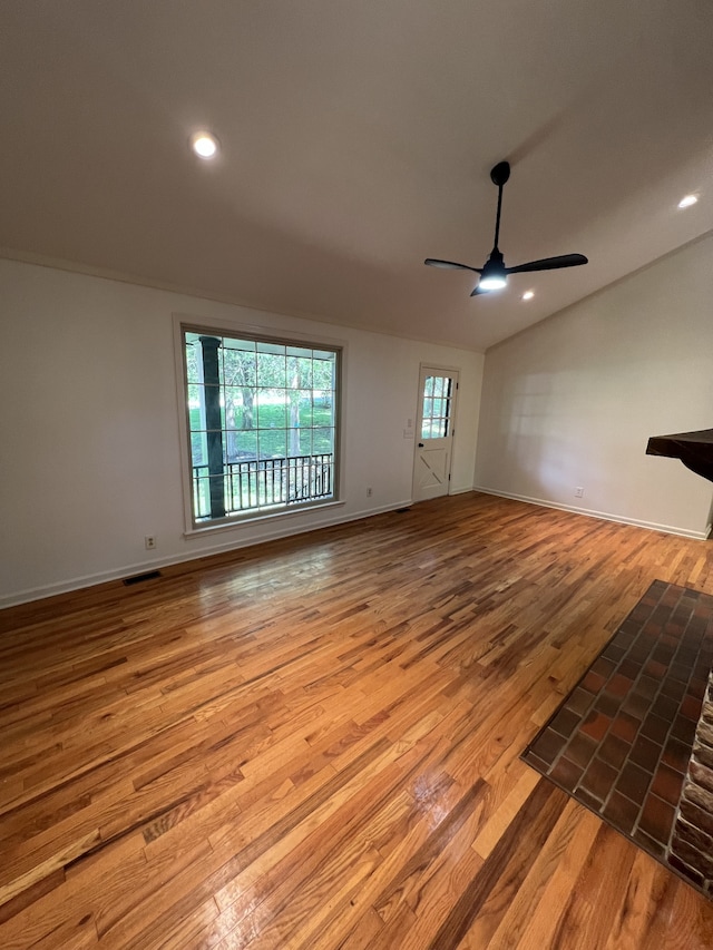 unfurnished living room featuring hardwood / wood-style floors and ceiling fan