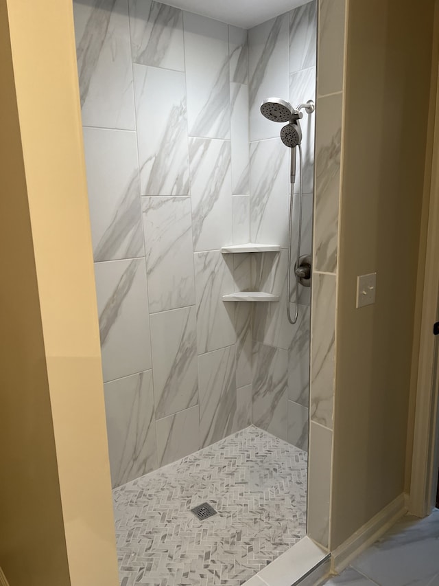 bathroom with tiled shower