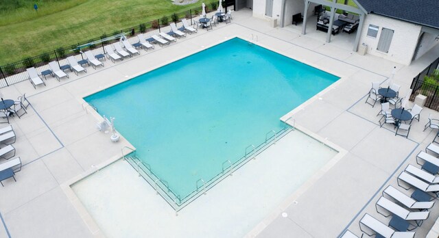 view of swimming pool featuring a patio area