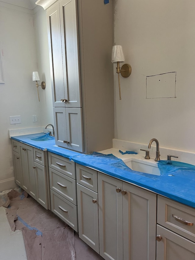 bathroom featuring vanity and ornamental molding