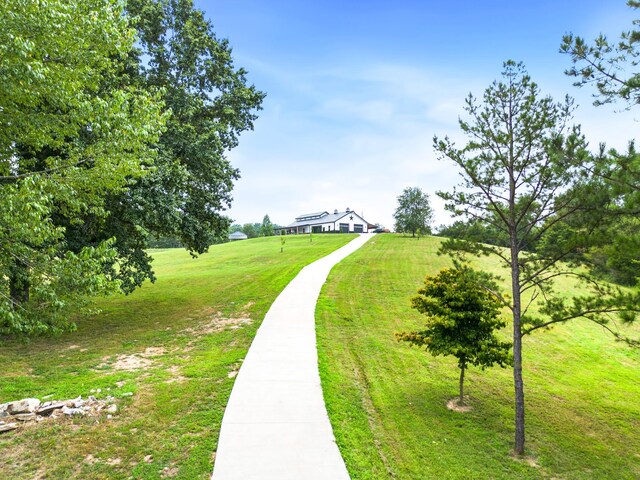 surrounding community featuring a yard