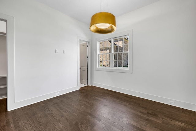 spare room featuring dark hardwood / wood-style flooring