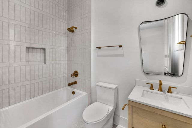 full bathroom featuring tiled shower / bath combo, vanity, and toilet