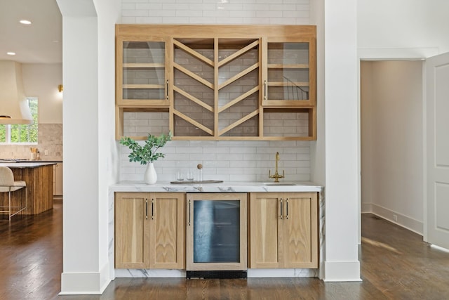 bar featuring sink, custom exhaust hood, dark hardwood / wood-style floors, beverage cooler, and decorative backsplash