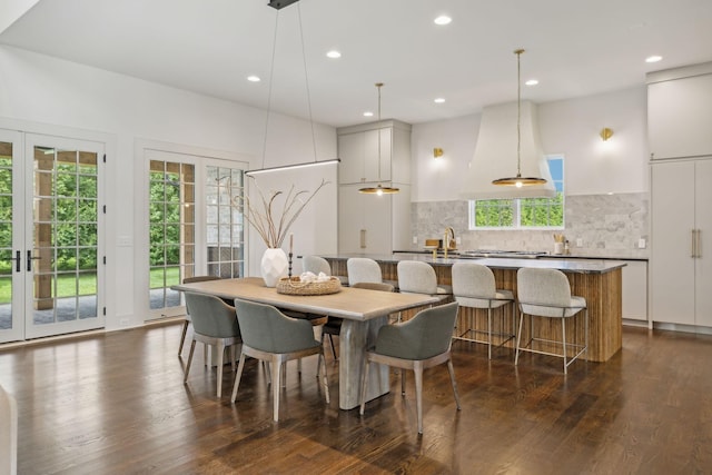 dining room featuring dark hardwood / wood-style floors and french doors