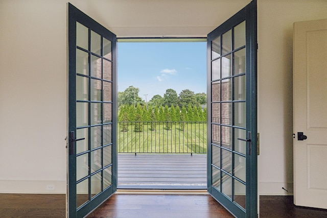 entryway featuring dark hardwood / wood-style flooring and french doors