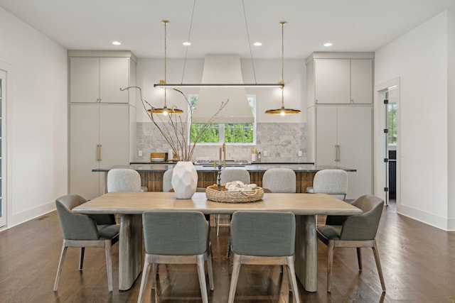 dining area with dark hardwood / wood-style flooring