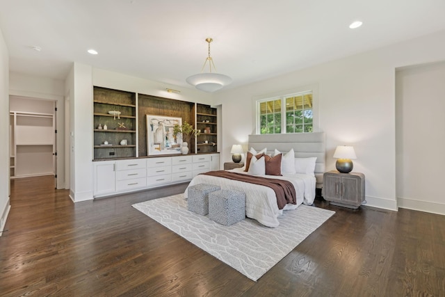 bedroom with dark wood-type flooring