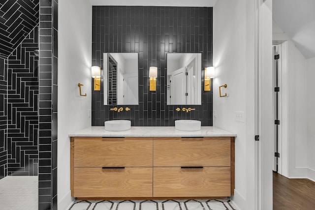 bathroom featuring tasteful backsplash, vanity, and hardwood / wood-style floors