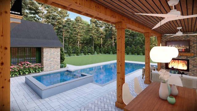 view of swimming pool with an outdoor brick fireplace, a patio area, and a lawn