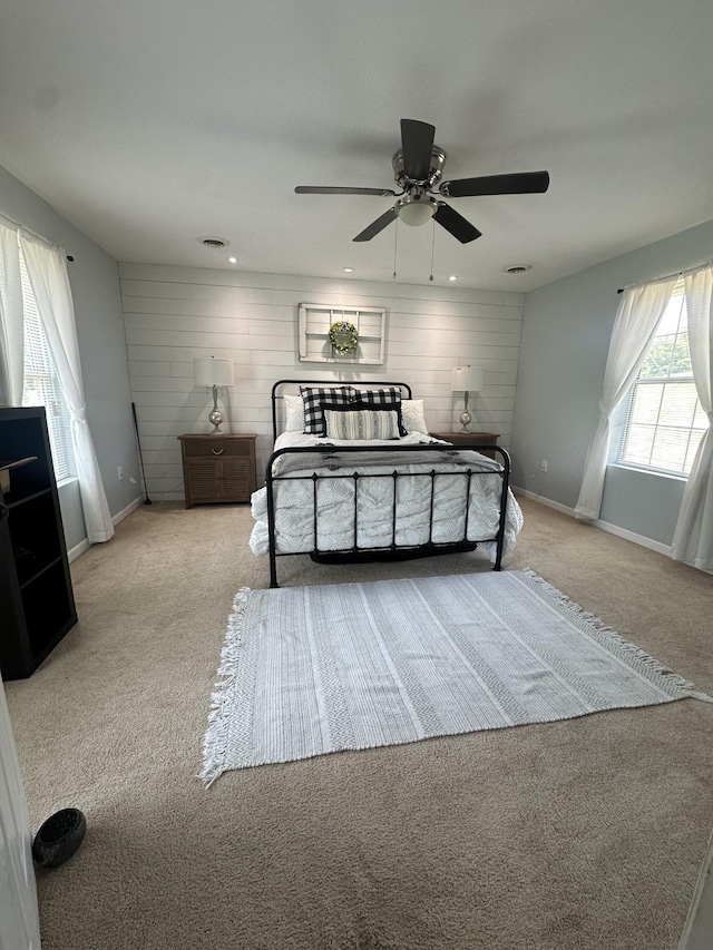 bedroom featuring baseboards, visible vents, a ceiling fan, light colored carpet, and recessed lighting