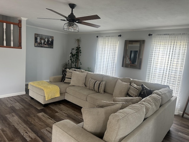 living area with ceiling fan, ornamental molding, dark wood-type flooring, and baseboards