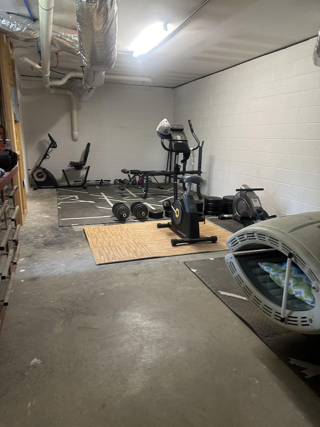 exercise room with concrete block wall