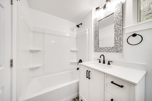 bathroom with vanity and washtub / shower combination