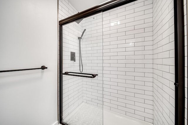 bathroom featuring an enclosed shower