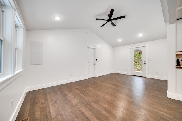 unfurnished living room featuring dark hardwood / wood-style flooring, electric panel, ceiling fan, and lofted ceiling