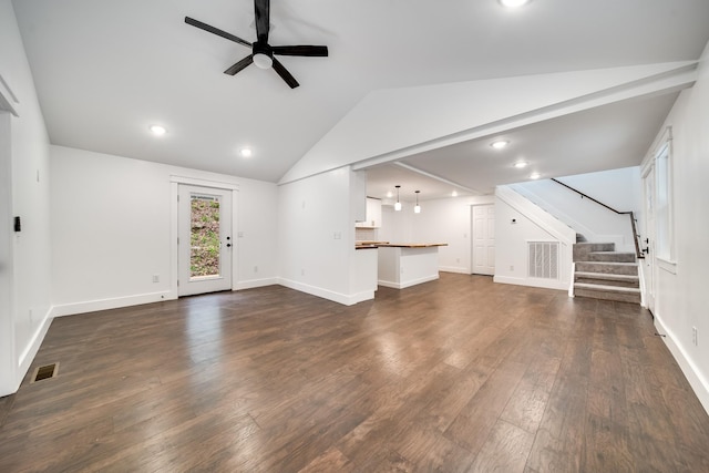 unfurnished living room with ceiling fan, lofted ceiling, and dark hardwood / wood-style floors