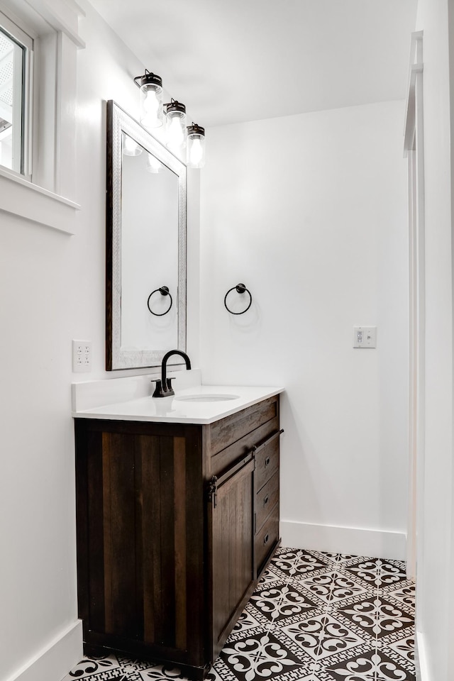 bathroom featuring tile patterned flooring and vanity