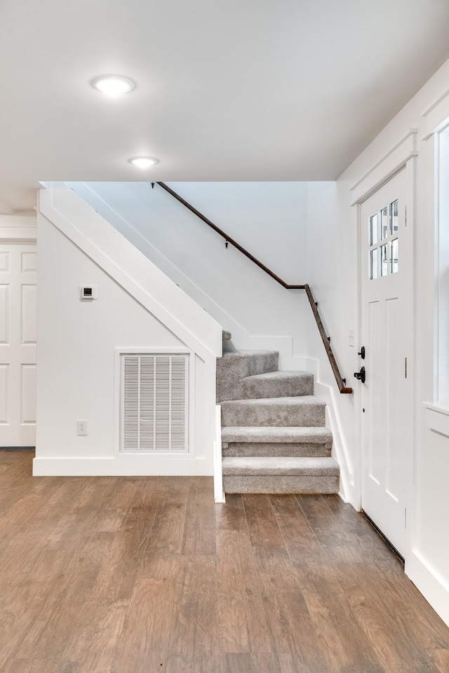 foyer entrance featuring wood-type flooring