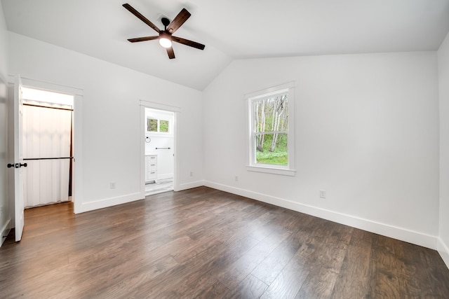 spare room featuring lofted ceiling, dark hardwood / wood-style floors, and ceiling fan