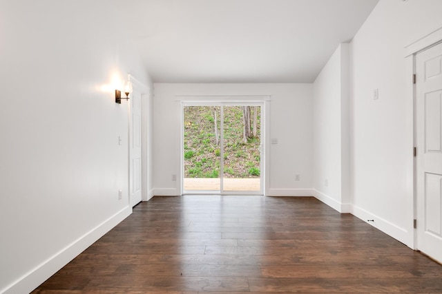 spare room featuring dark hardwood / wood-style floors