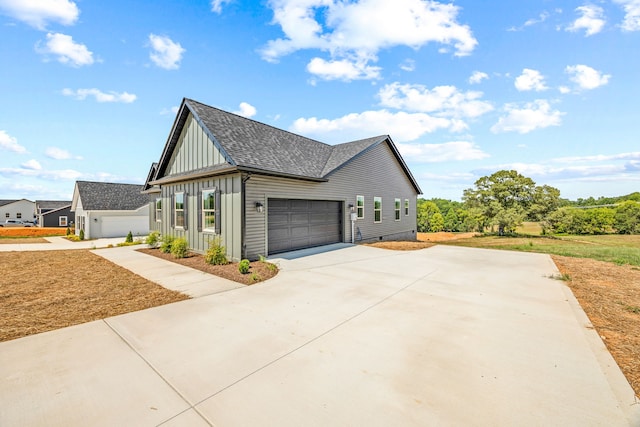 view of side of home with a garage