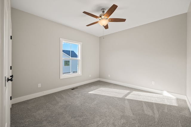 carpeted empty room with ceiling fan