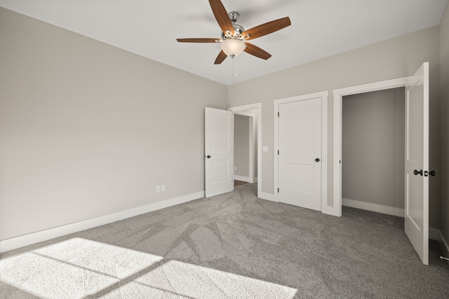 unfurnished bedroom with ceiling fan and carpet flooring