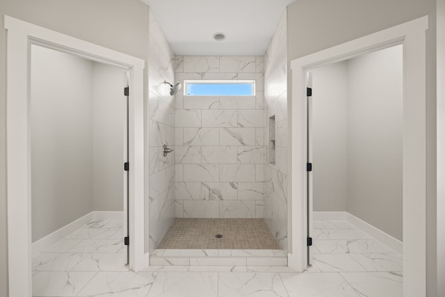 bathroom with tiled shower