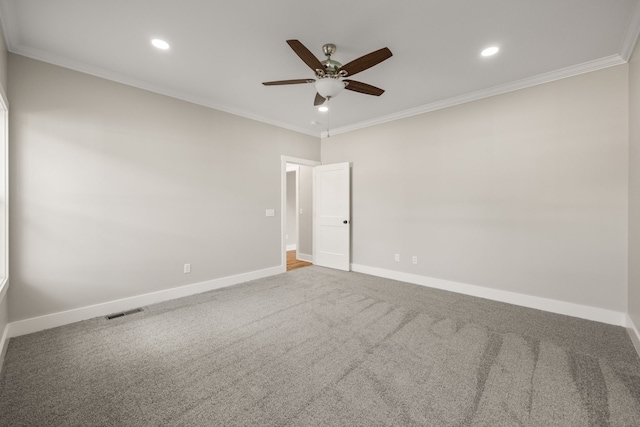 unfurnished room with ceiling fan, carpet floors, and crown molding