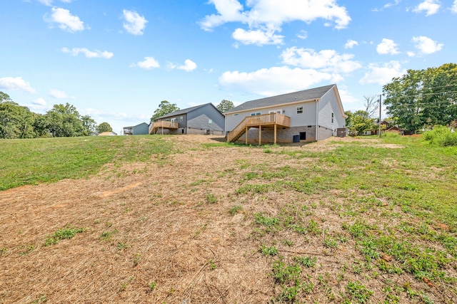 view of yard with a wooden deck