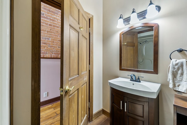 bathroom featuring vanity and hardwood / wood-style flooring