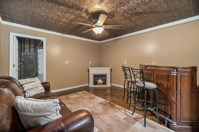 tiled living room featuring crown molding and ceiling fan