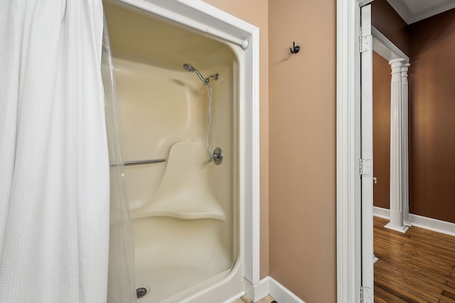 bathroom with hardwood / wood-style flooring