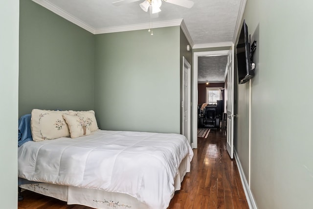 bedroom with ornamental molding, dark hardwood / wood-style flooring, a textured ceiling, and ceiling fan